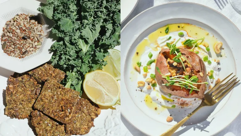 Plate with seeded crackers, kale leaves, lemon wedges, and a bowl of grains beside a plated stuffed sweet potato.